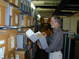 Archivist Tom Owen checking University records. Photo by Bill Carner